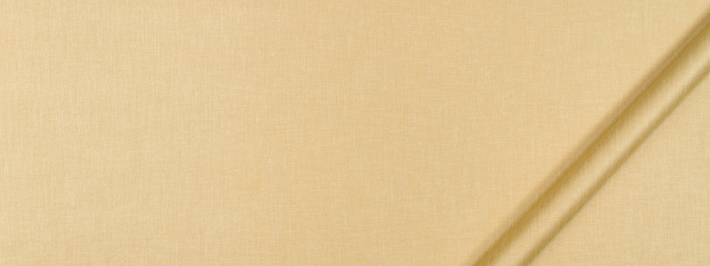 Beige linen fabric close-up with subtle weave and two diagonal light wooden dowels in the top-right corner.