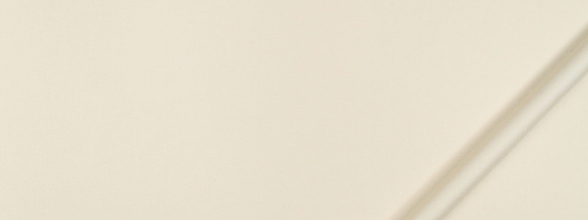 Cream fabric swatch with a subtle texture; a slim diagonal chrome rod crosses a beige background.