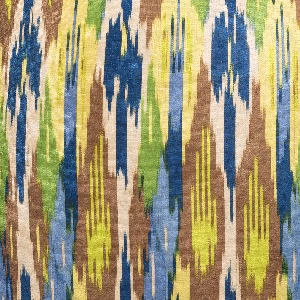Abstract ikat-inspired fabric with vertical color streaks in lime green, yellow, blue, olive green and brown on beige.