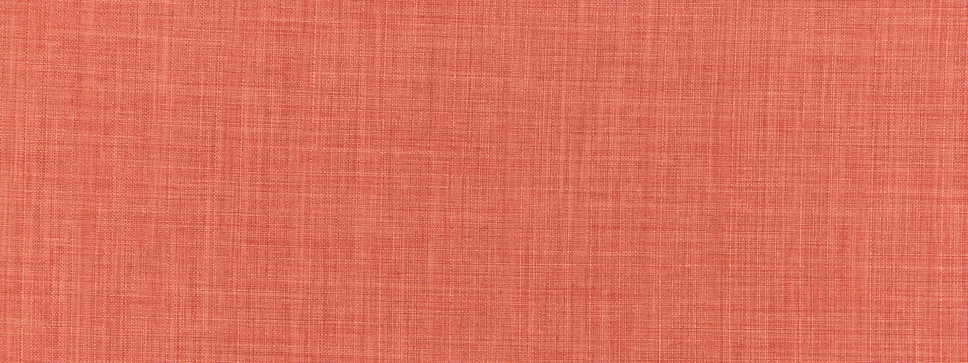 Peach-orange textured woven fabric close-up.