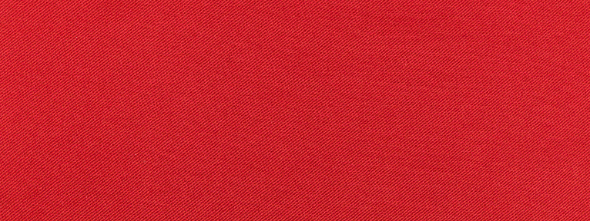 Bright lacquer red fabric texture close-up; bold color for clothing or home decor.