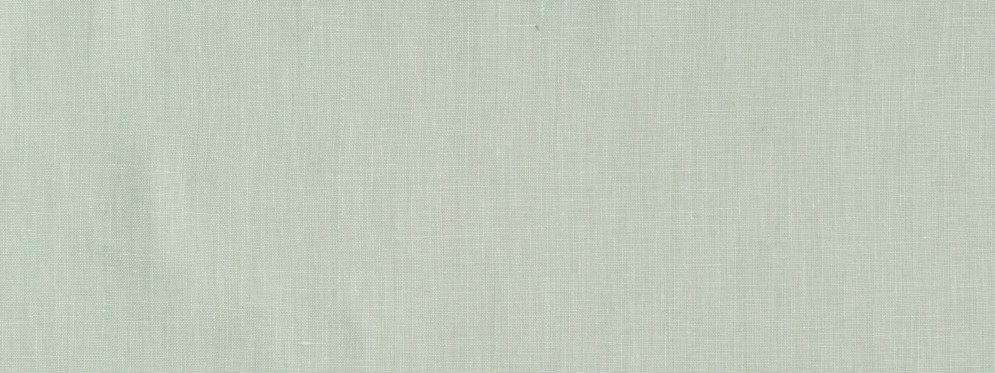 Light sage green linen fabric texture close-up with soft woven fibers.