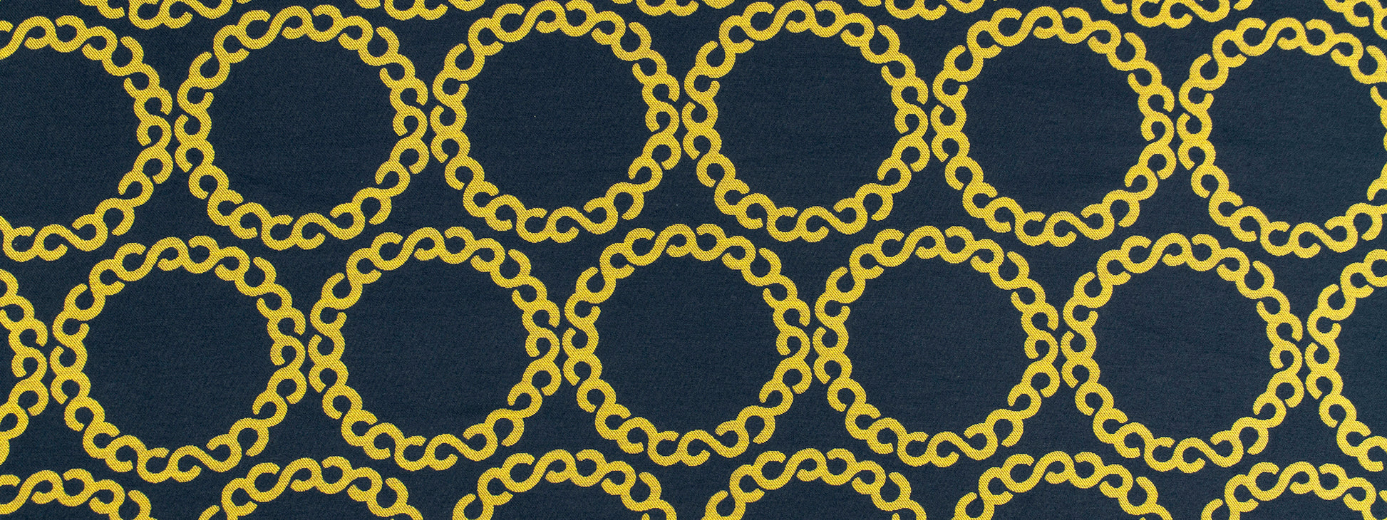 Slate upholstery fabric with a repeating gold chain-link circular ring motif.