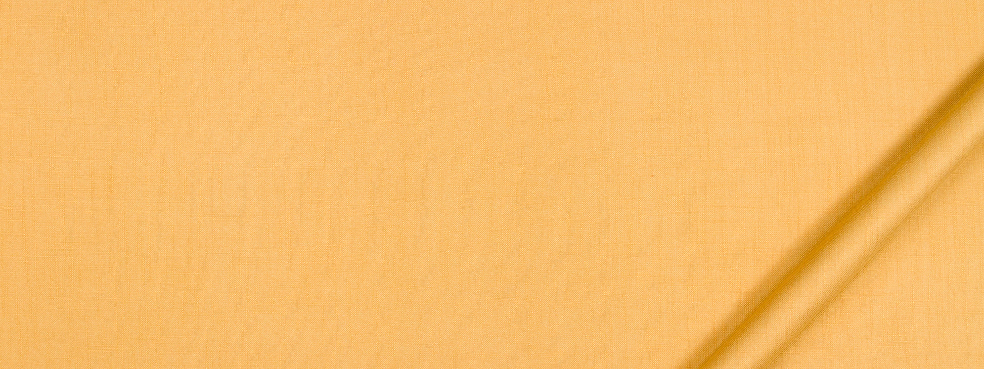 Yellow-orange fabric close-up with a diagonal seam, sunny textile suitable for garments or decor.