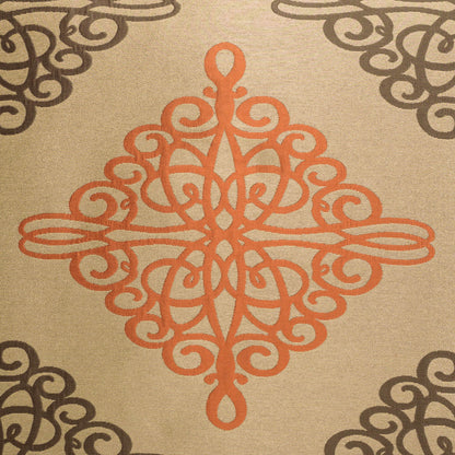 Beige fabric with orange ornamental center medallion and dark brown corner scroll patterns on a 24 x 24 inch pillow.