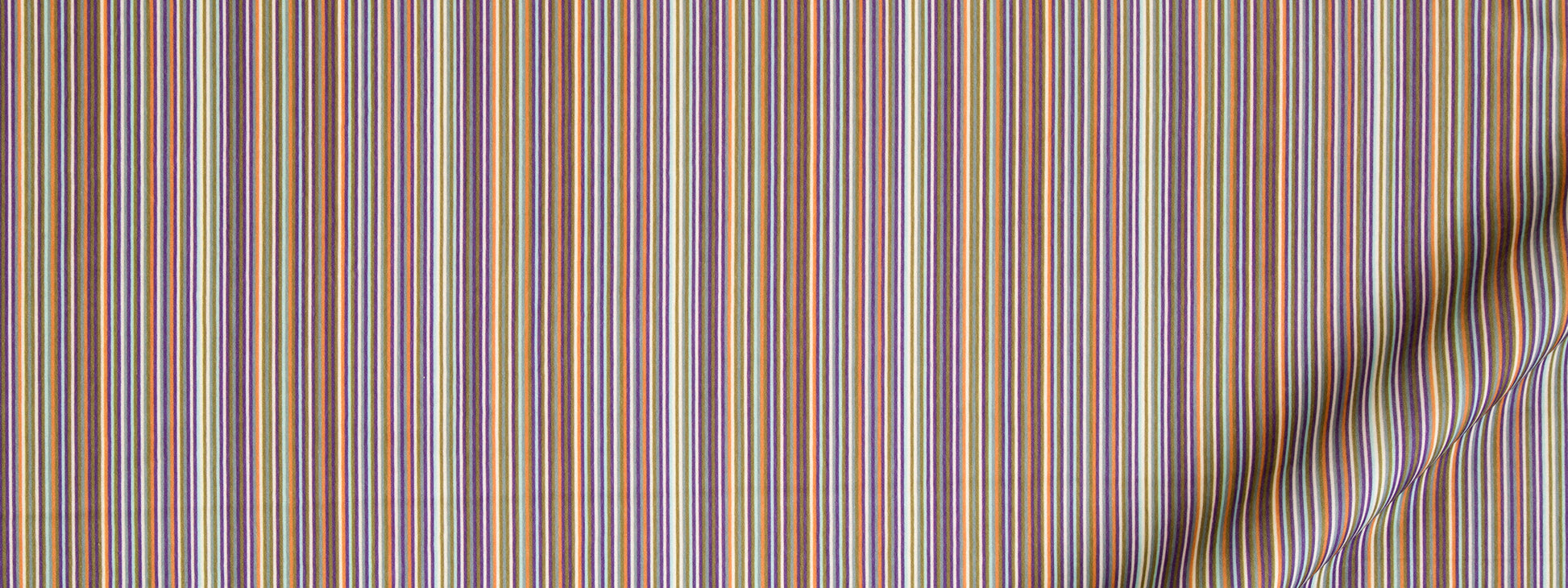Colorful vertical striped fabric in purple, blue, orange, yellow; lightweight textile with folded edge.