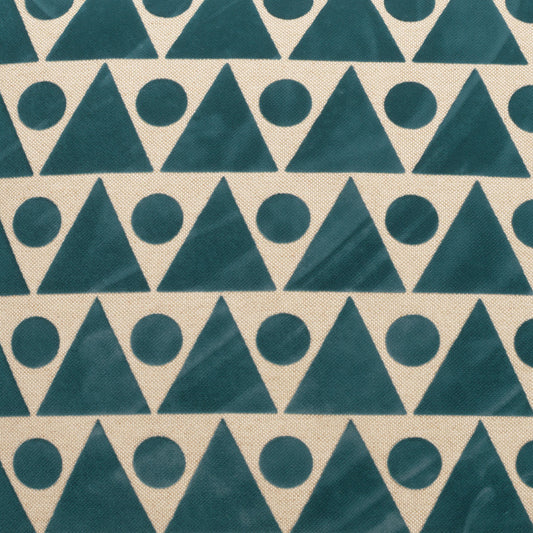 Teal triangle-and-circle geometric print on beige fabric; mid-century style upholstery textile.