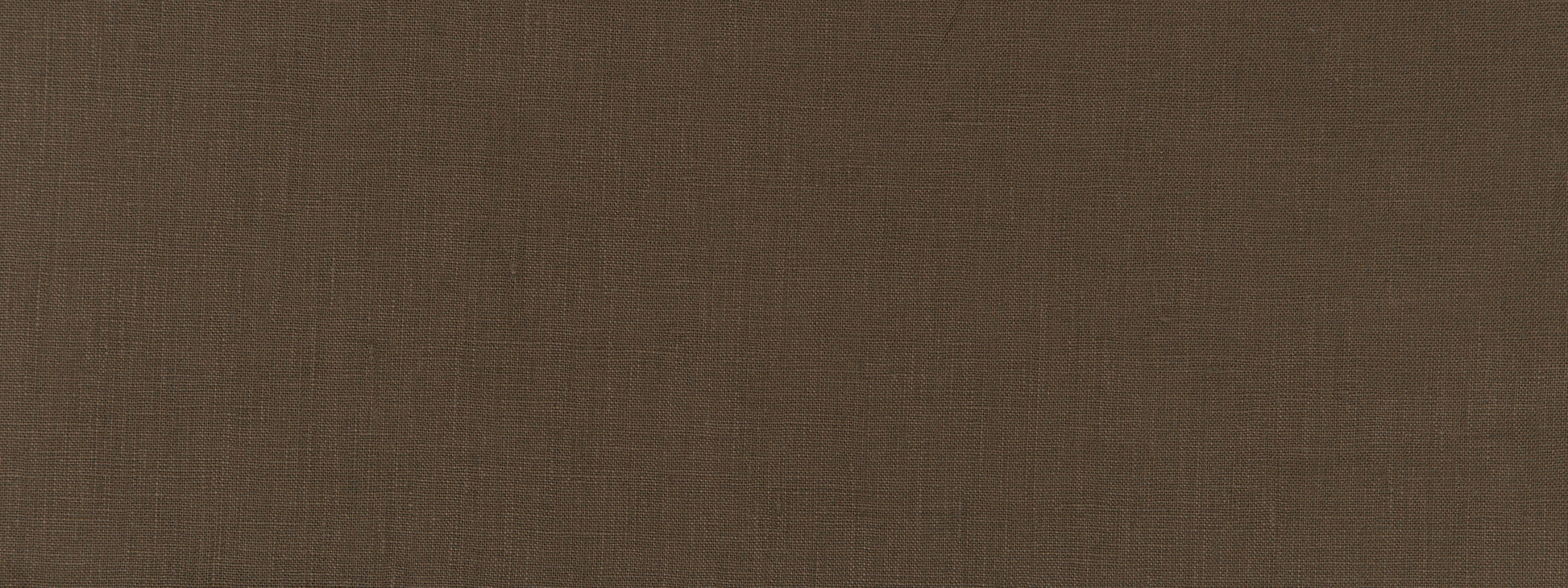 Close-up of brown linen-textured fabric with a subtle weave, rustic warm backdrop.