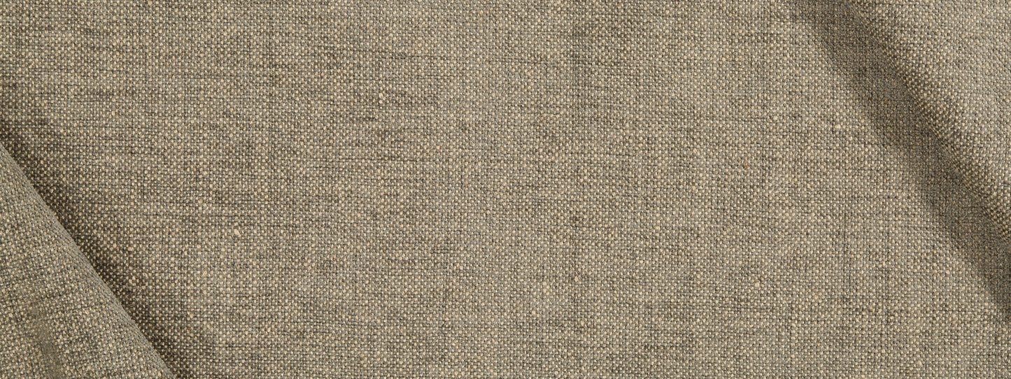 Beige jute chenille upholstery fabric close-up with visible weave and soft drape.