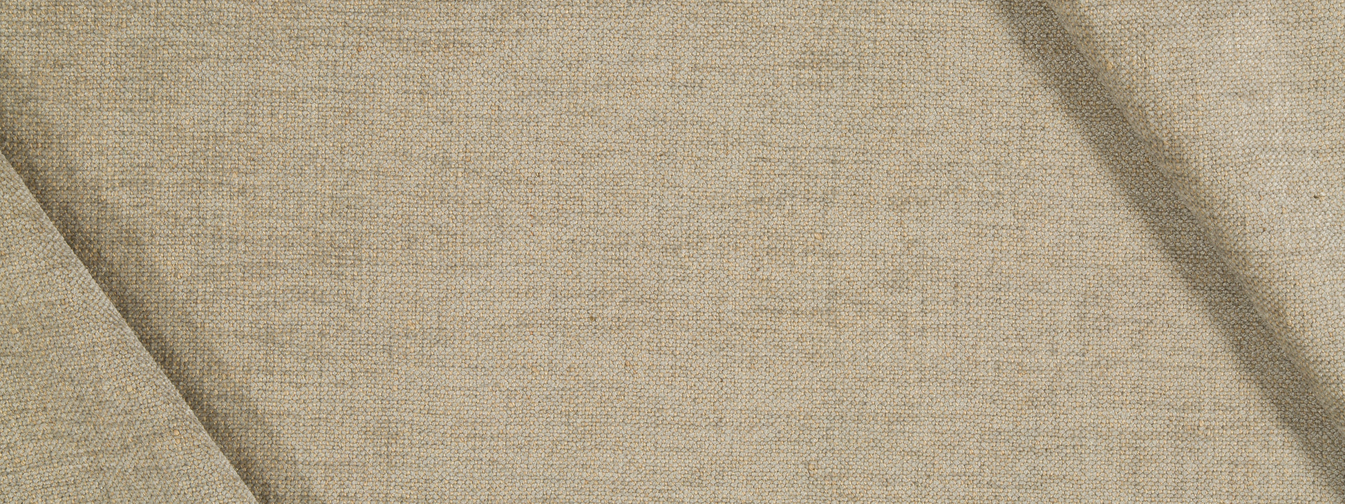 Beige jute chenille upholstery fabric with visible weave and diagonal folds; natural textile texture.