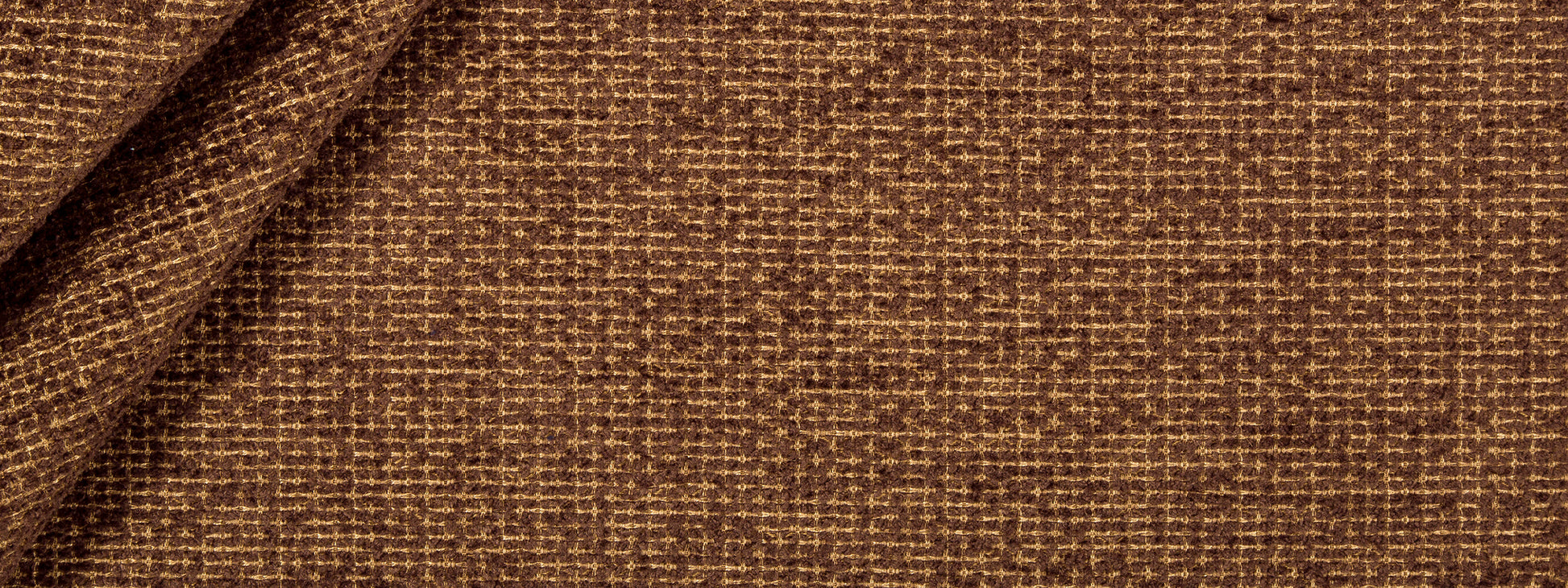 Brown woven fabric texture with coarse interlacing & subtle diagonal fold; upholstery or home decor material.