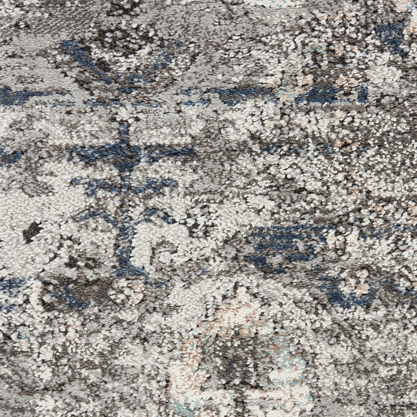 Distressed gray and beige oriental rug with blue accents and faded floral medallion pattern, plush pile.