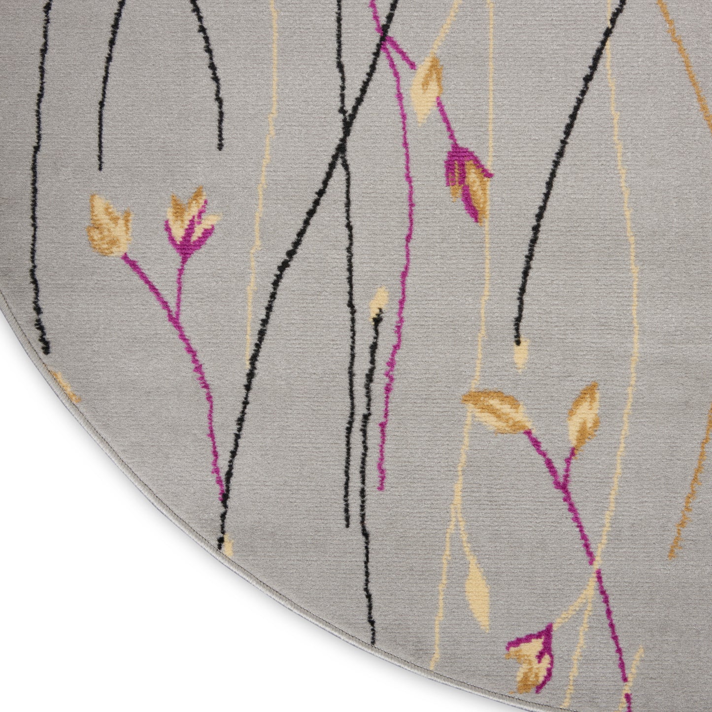 Round gray rug with abstract black, magenta and beige vertical lines and yellow leaf accents.