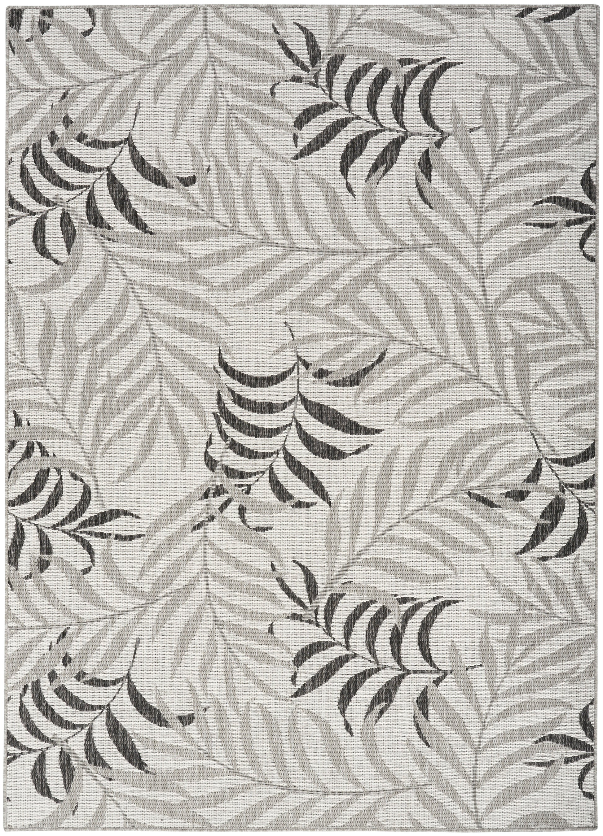Rectangular gray area rug with light and dark palm leaf pattern; modern botanical design.