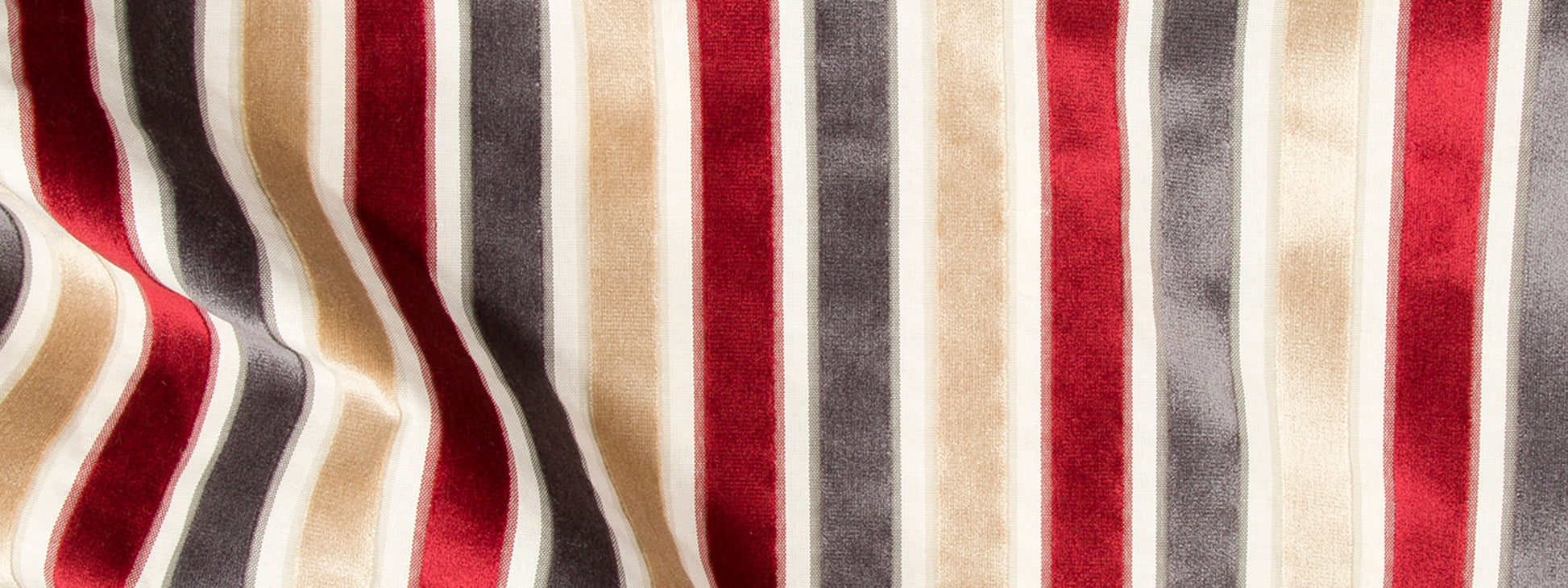 Striped velvet fabric with vertical red, cream, beige and gray stripes; soft, luxurious for upholstery or drapes.