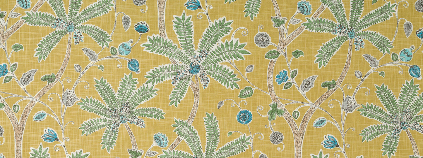 Amber-yellow fabric with teal and mint green Indian-inspired pattern and blue circular accents.