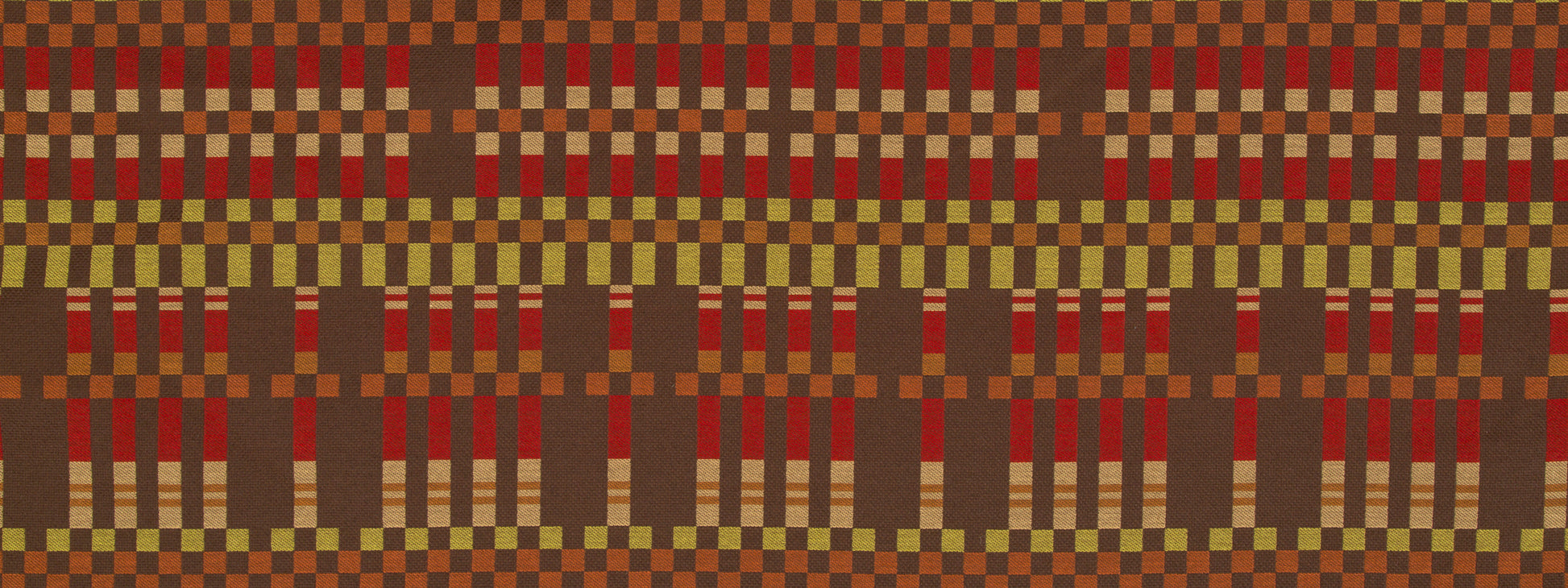Earth-toned woven fabric with a dense checkerboard pattern of reds, browns, ochre and olive.