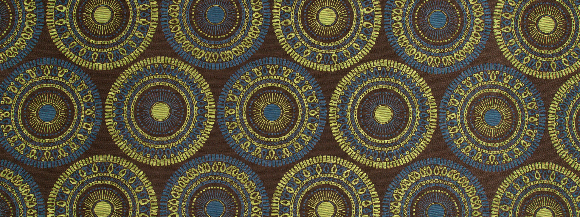 Repeating circular mandala pattern in blue and gold on a dark brown fabric background.
