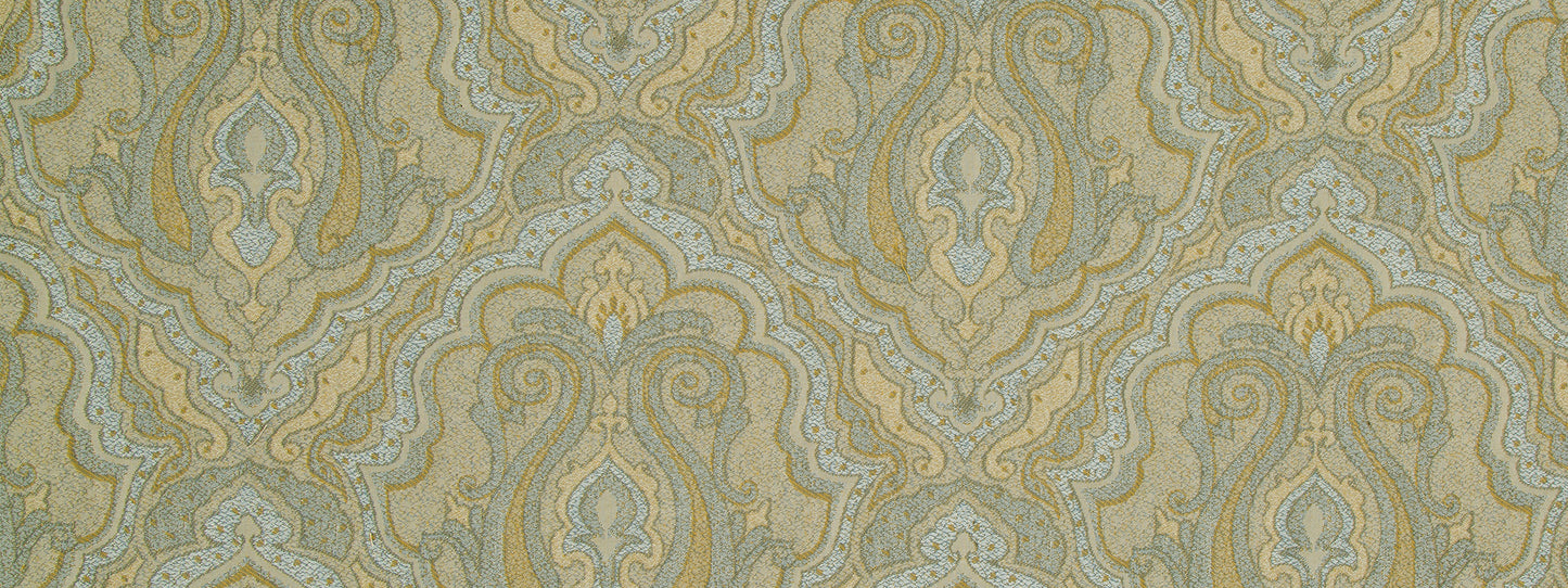 Damask upholstery fabric in gold, teal & pale blue with ornate scrolls & floral motifs on a muted beige background.