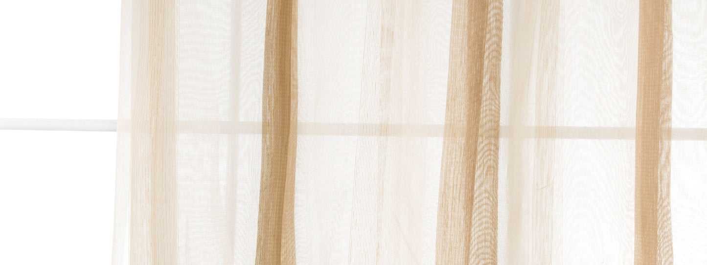 Beige sheer curtain panels in light-filtering fabric, soft vertical folds by a sunlit window.