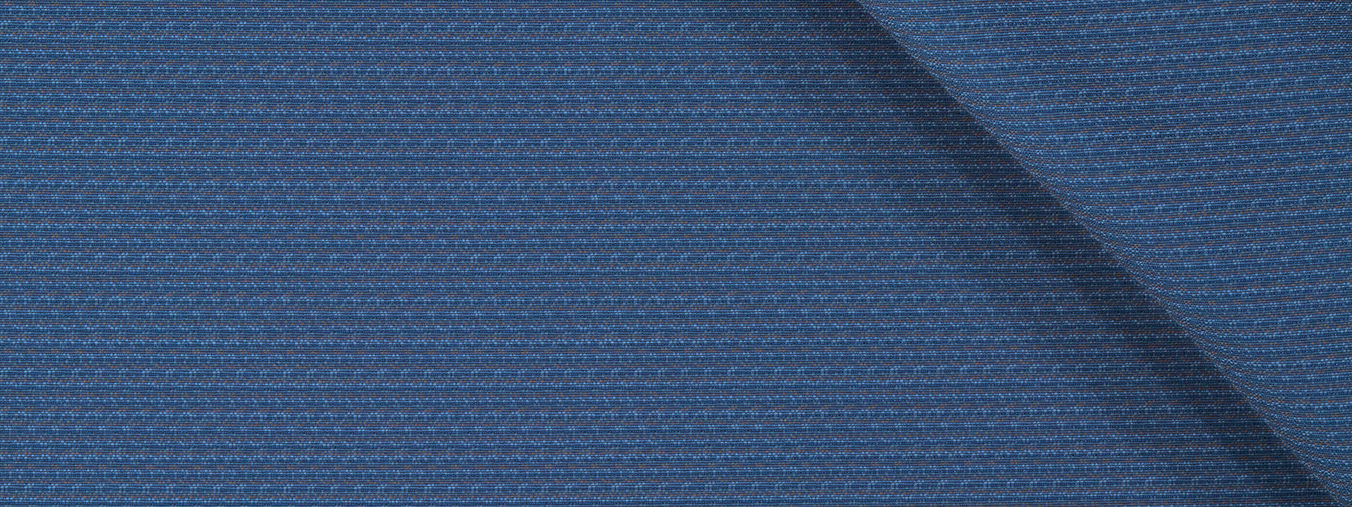 Close-up of blue textured upholstery fabric with a ribbed pattern and diagonal seam.