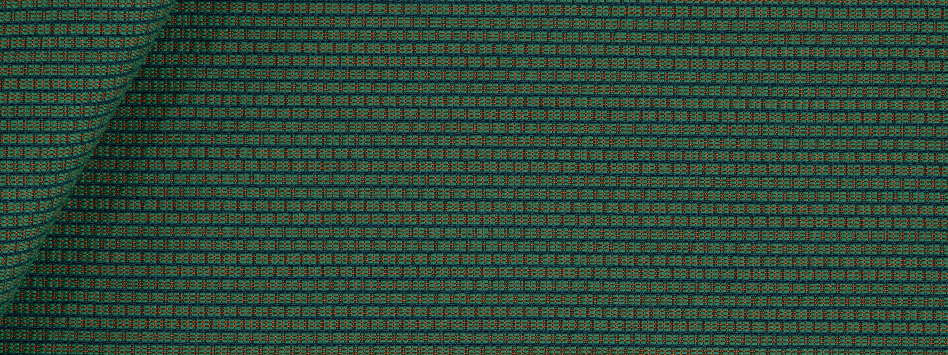 Teal & emerald green woven upholstery fabric with a tiny square grid pattern, folded corner revealing a textured weave.