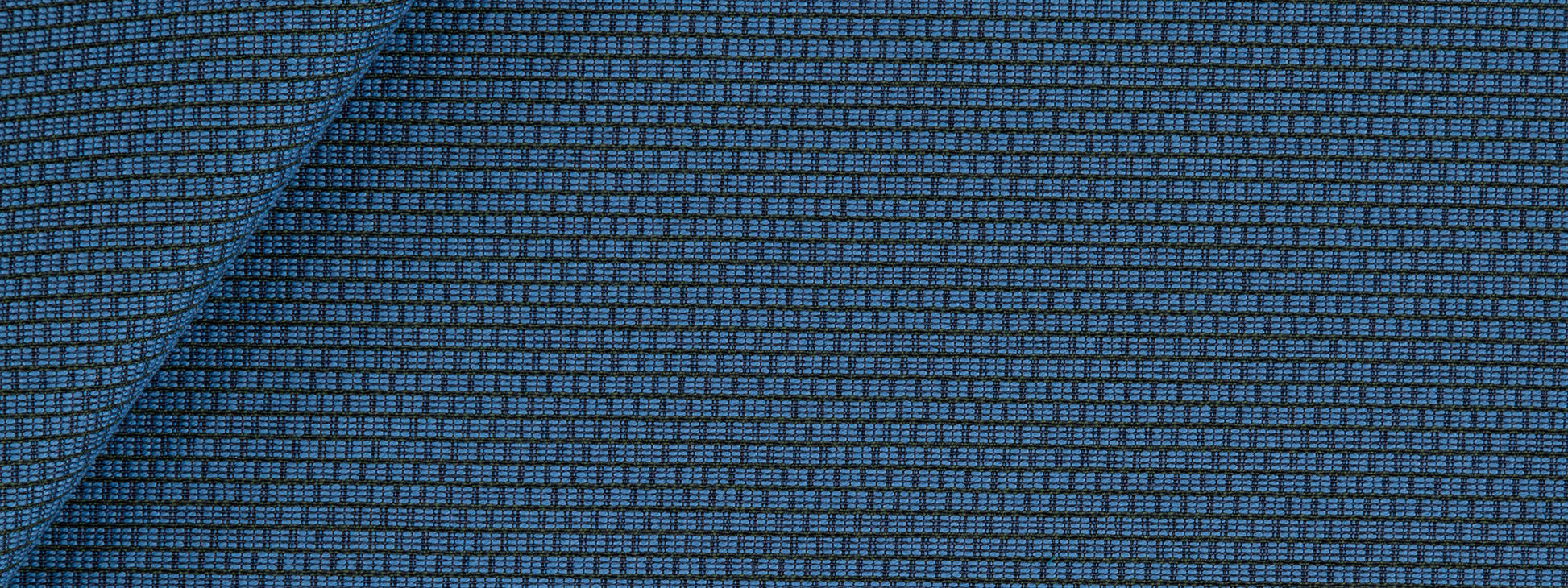Blue textured woven upholstery fabric with a tiny square grid pattern.