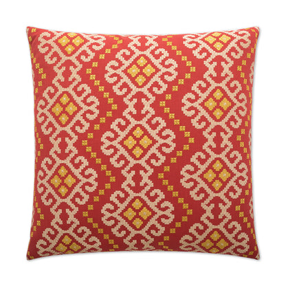 Red throw pillow with white geometric lattice pattern and yellow diamond accents.