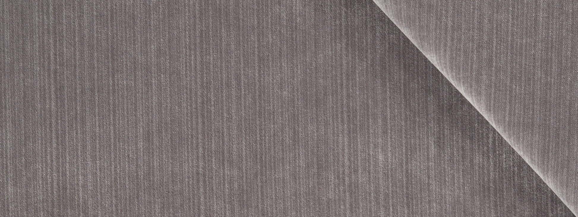 Gray corduroy fabric close-up with vertical ridges and a diagonal fold.