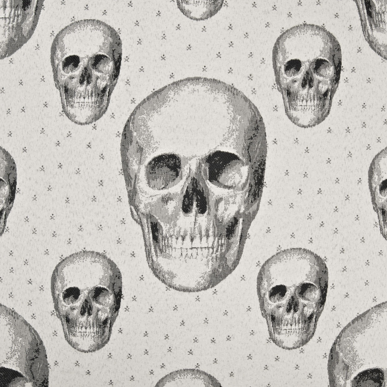 Gray fabric with a vintage skull motif and tiny star accents; edgy textile for clothing or home decor