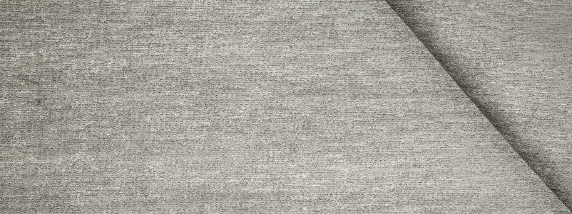 Charcoal chenille upholstery fabric with a soft, heathered texture and a diagonal fold.