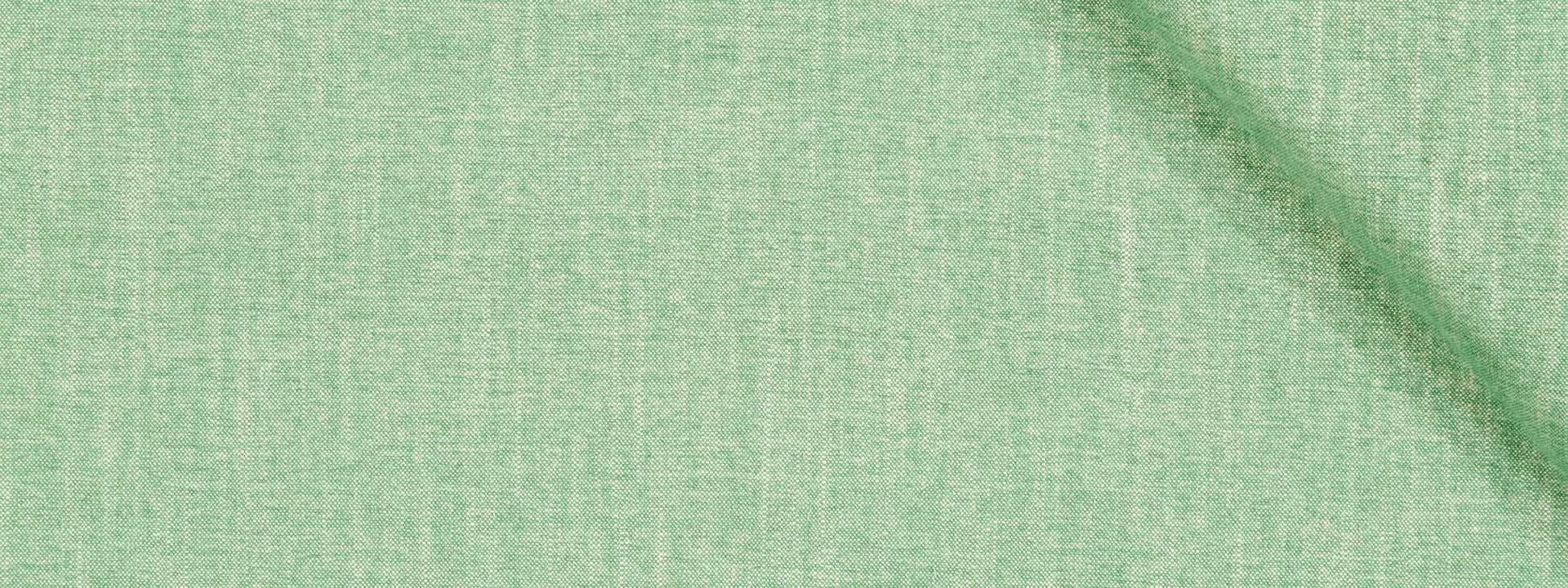 Mint green chenille upholstery fabric close-up with woven texture and subtle diagonal shadow.
