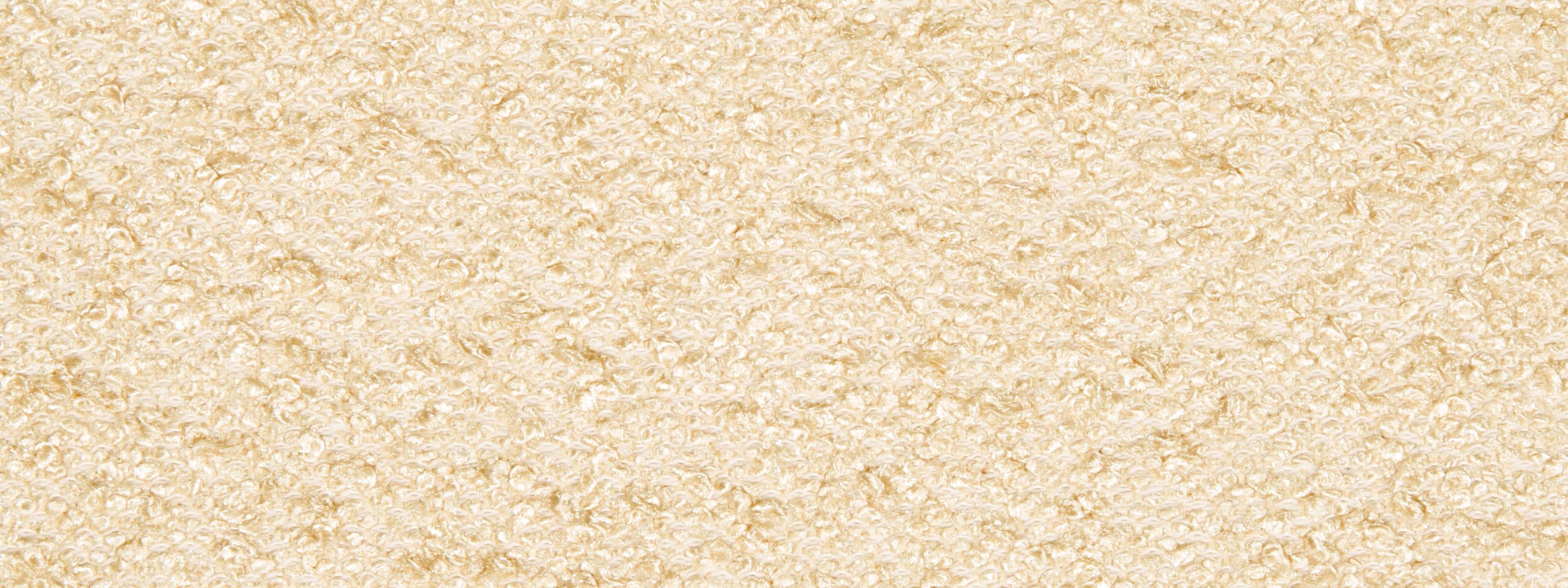 Beige boucle upholstery fabric; close-up.