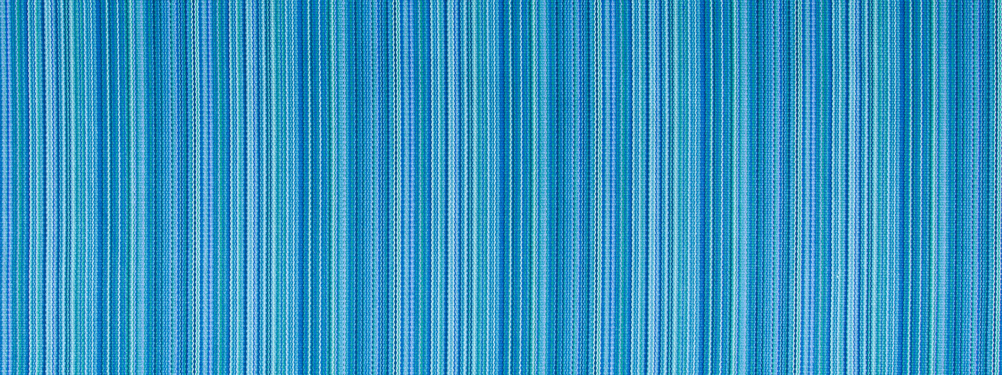 Blue upholstery fabric with a zigzag stripe pattern in varying blues; woven textile.