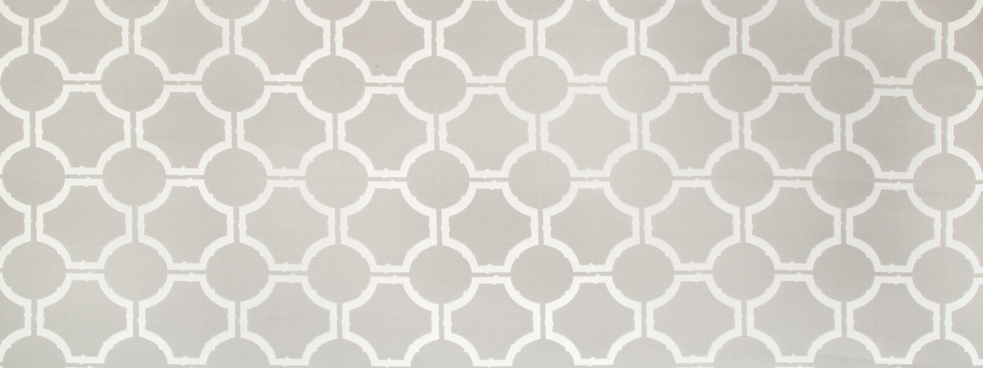 Taupe background with a white interlocking circular lattice pattern.
