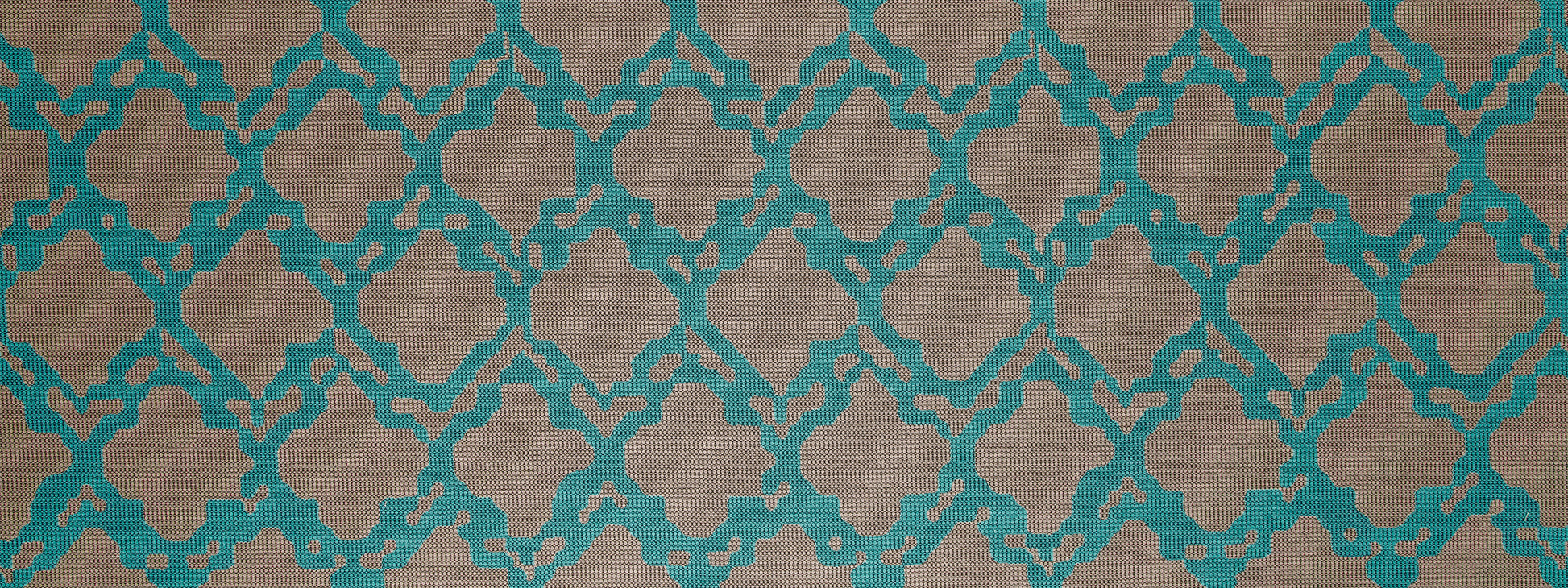 Teal Moroccan trellis pattern on beige fabric; decorative textile for upholstery or wallpaper.