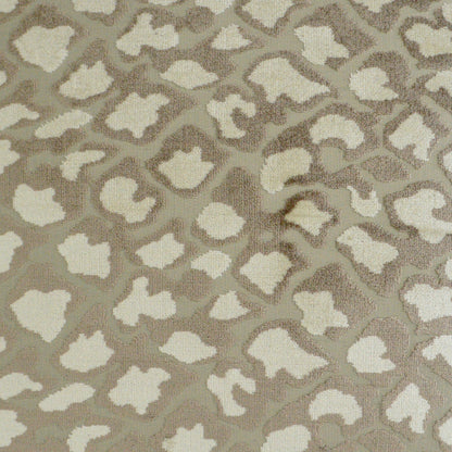 Ivory pillow with a subtle leopard-like animal print; soft textured fabric, 24" x 24