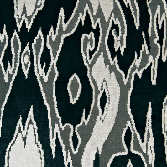 Ikat-style fabric in navy with light gray abstract motifs; versatile upholstery or drapery fabric.