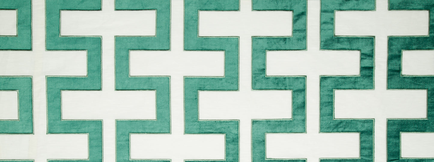 Turquoise-green Carioca Key fabric pattern with interlocking cross shapes and white gaps.