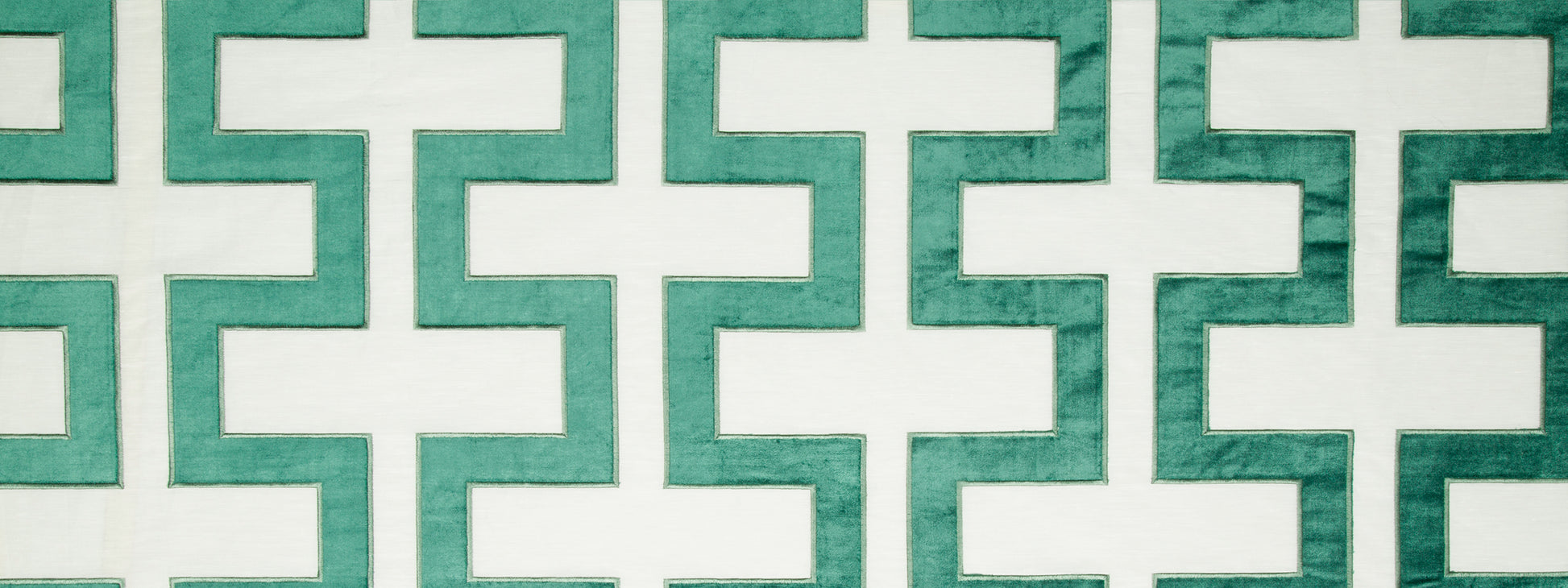 Turquoise-green Carioca Key fabric pattern with interlocking cross shapes and white gaps.