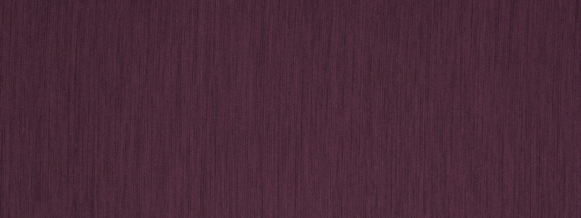 Deep burgundy corduroy fabric with narrow vertical ridges; soft, durable textile for clothing or upholstery.