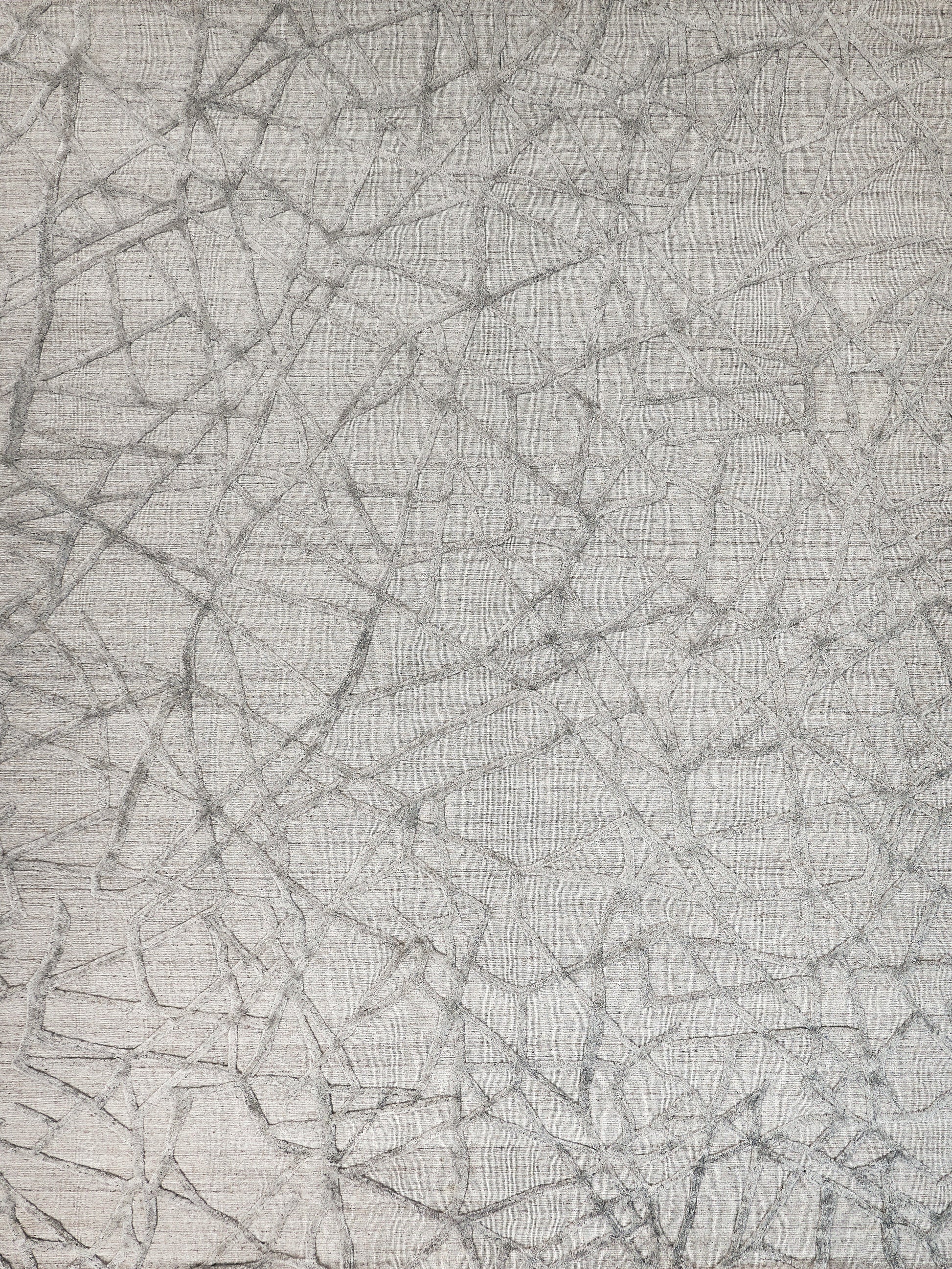 Light gray textured rug featuring an abstract network of dark gray irregular lines.