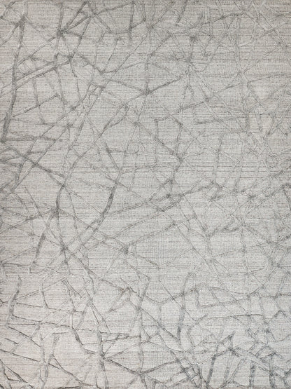 Light gray textured rug featuring an abstract network of dark gray irregular lines.