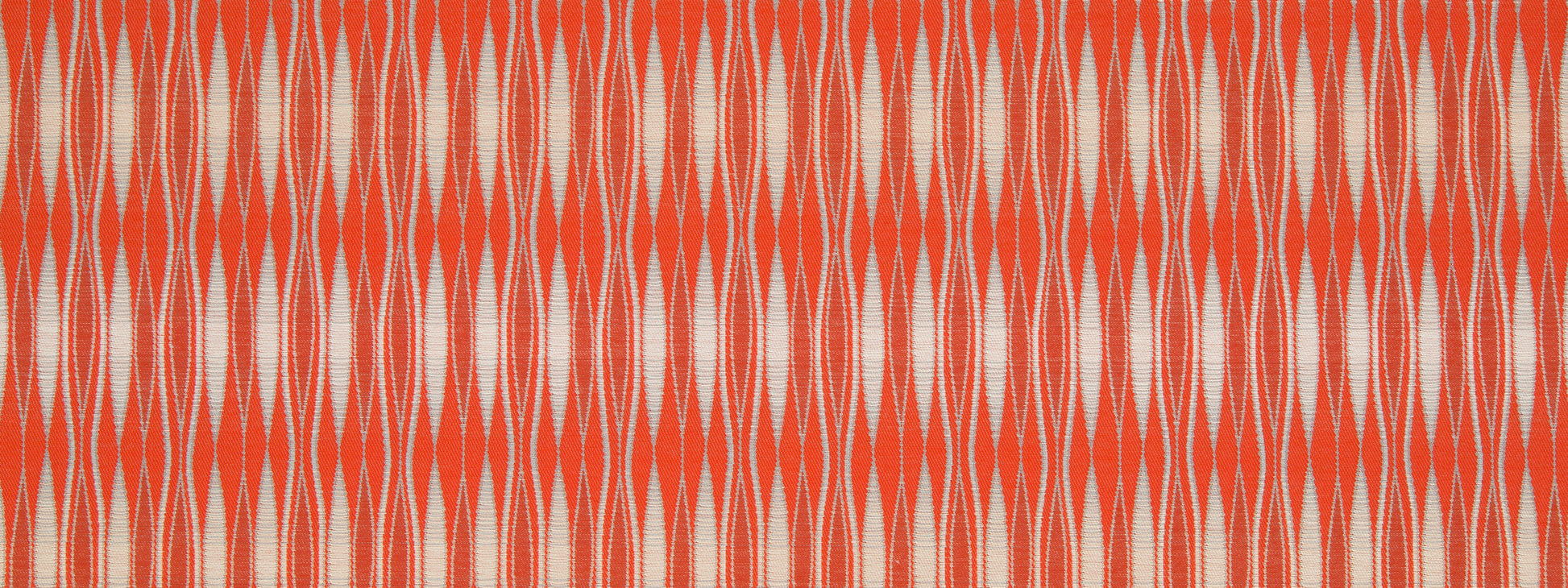 Orange and cream ikat-style fabric pattern with elongated diamonds; textile texture for upholstery or clothing.