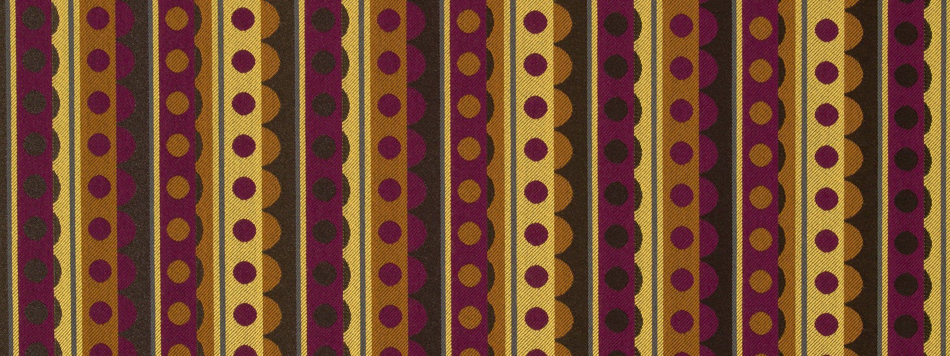 Upholstery fabric with vertical purple & gold stripes and a repeating circular-dot pattern; bold ethnic-inspired print.