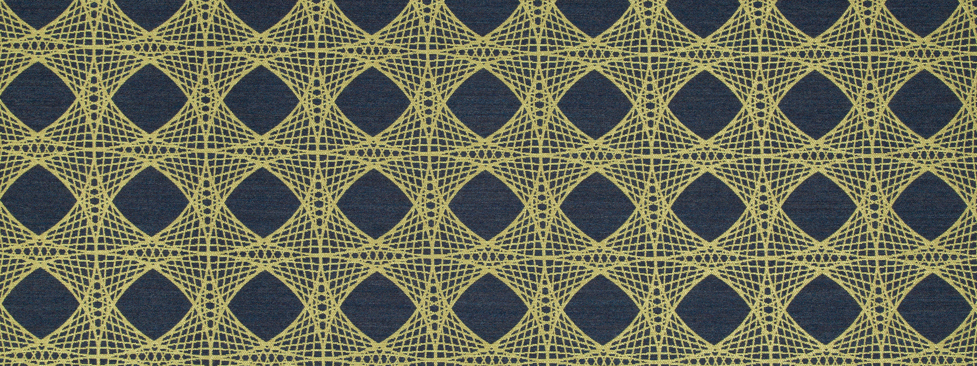 Mustard-yellow geometric lattice upholstery fabric with interlocking diamonds on navy background.