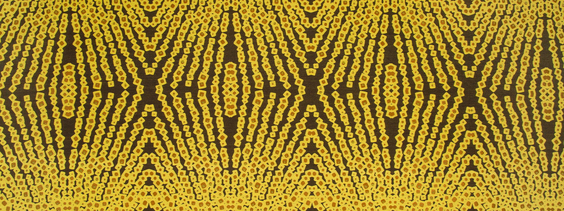 Yellow and brown geometric upholstery fabric with a repeating diamond lattice pattern.