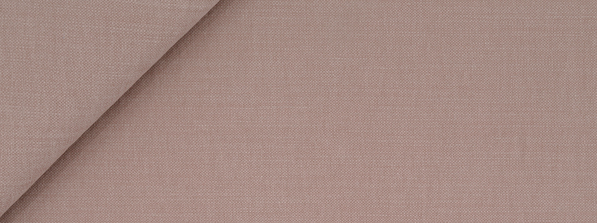 Blush brushed linen fabric with a textured weave and diagonal fold.