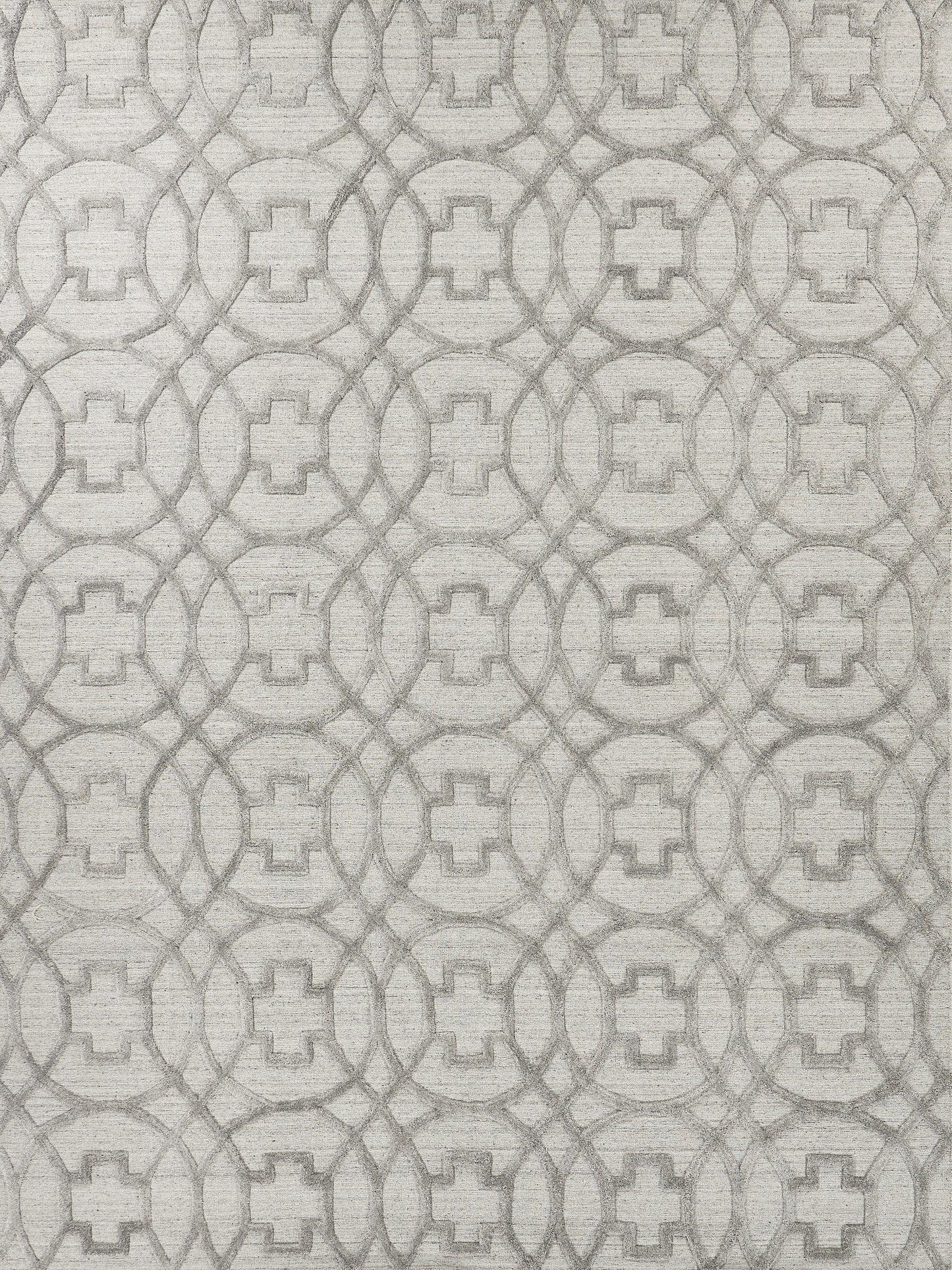 Neutral gray textured rug featuring a repeating interlocking circle pattern with square centers.