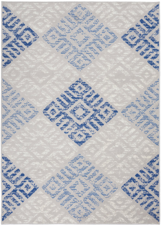 Geometric area rug with large light gray diamonds and blue square motifs in a woven pattern.